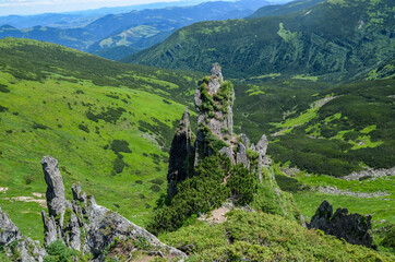 Sharp rocks with big rocky boulders on summer mountain slope of Shpytsi (Spitz) mountain....