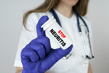 The doctor holds a medicine in his hands, which says - STOP NEURITIS