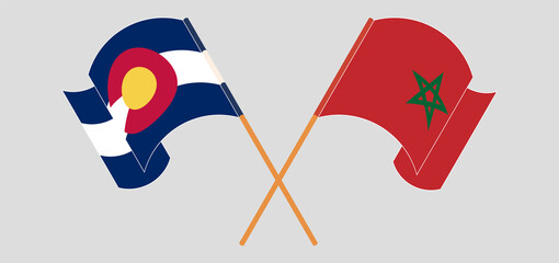 Crossed and waving flags of The State of Colorado and Morocco