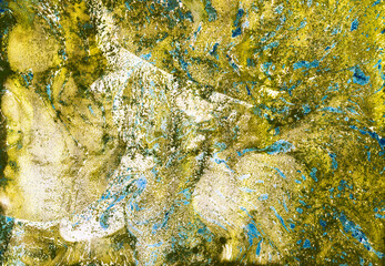 Liquid art. Fluid Art Painting. Yellow turquoise and Green colors. Marble effect. Colorful abstraction.