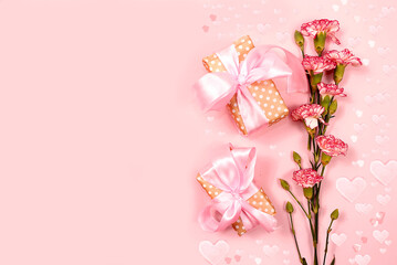 Fototapeta na wymiar Concept for Valentine's Day or Women's Day. Postcard, hearts, flowers and gift boxes on a pink background, place for text, banner, Happy holidays, congratulations, birthday, wedding, selective focus