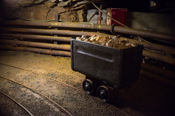 old mining carts with wheels on rail for the transportation of minerals