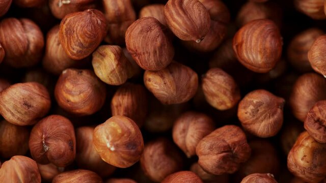 Super Slow Motion Detail Shot of Flying and Rotating Hazelnuts at 1000 fps.