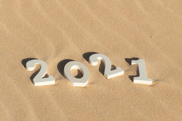 Fototapeta na wymiar 2021 on sand dunes background