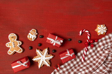 red biscuit gift wooden background new year cookies top view copy space