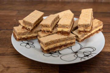Fototapeta na wymiar Tasty chocolate, figs, and vanilla wafers sandwich. Creamy wafer biscuit texture