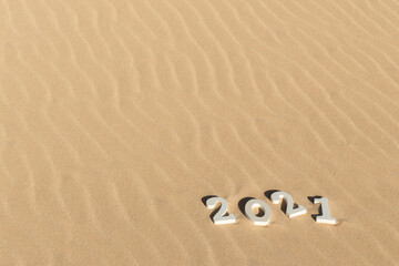 Fototapeta na wymiar 2021 on sand dunes background