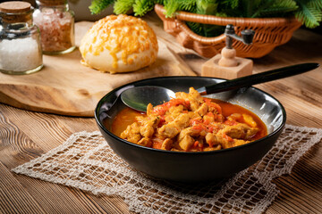 Chicken fricassee with red paprika and onion.