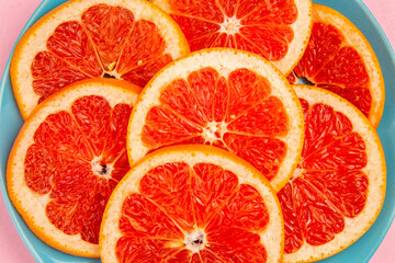 top view tasty grapefruits fruit slices inside plate on pink background fresh citrus fruit juice mellow color