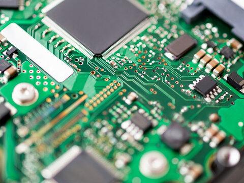 Macro photo of hard disk controller board. IT detail in computer. Technical background.