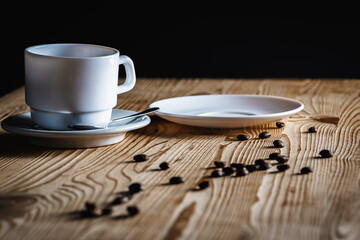 close up view, cup of white coffee with tea plates on wooden surface with space. Morning coffee concept
