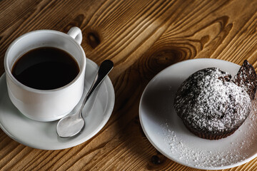 Classic espresso, coffee with coffee chip muffin on an old wooden table. Morning coffee. Top view.