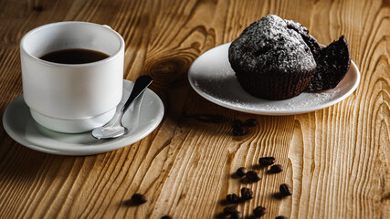 Fototapeta na wymiar Classic espresso, coffee with coffee chip muffin with coffee beans on an old wooden table. Morning coffee. Top view.