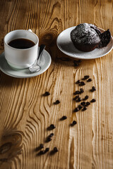Classic espresso, coffee with coffee chip muffin with coffee beans on an old wooden table. Morning coffee. Top view.