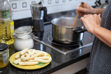 Preparing churros with hot chocolate at home