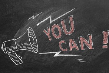 Loudspeaker with text You Can. Business motivational inspirational quotes. Illustration hand drawn in chalk on a blackboard. Words of motivation. Concept of ability and possibility.