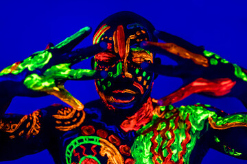 afro american man posing in studio shot with UV light