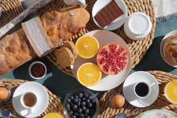 breakfast brunch with toast bread coffee tea orange pomegranate salmon