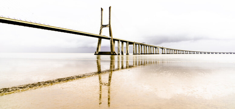 A high key panorama view of the Vaco da Gama Bridge in Lisbon