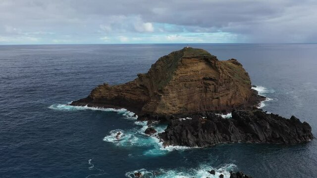 An aerial view. Drone. Landscape with the sea and picturesque shore. From above drone view of picturesque sea bay with rocky cliffs on mountainous coast with green hills.