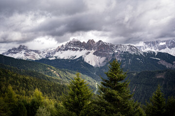 Fototapeta na wymiar snow covered dolomites mountains in autumn on cloudy day