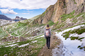 woman hiking in the austrian dolomites on trekking trail