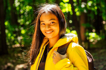 african american woman in yellow jacket outdoors