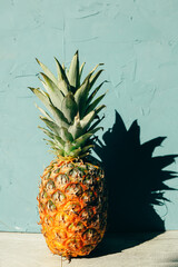 Large ripe pineapple with a shadow