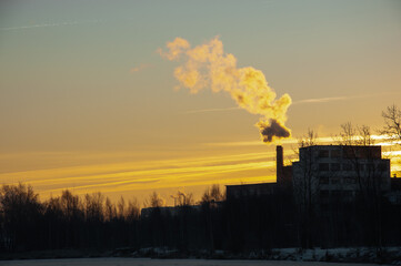 Factory chimneys that pollute the air. Smoke from the chimney. Ecological problem.