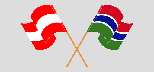 Crossed and waving flags of Austria and the Gambia