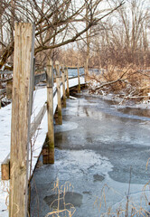 Ice Covered Pond with Wood Path
