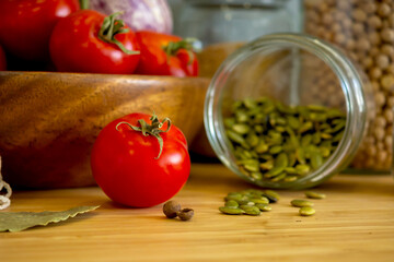 Zero waste healthy food-cereals, seeds, vegetables flat lay on grey background. Groceries in textile bags,glass jars, wooden bowl. Eco friendly plastic free low waste lifestyle.