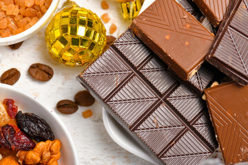 sweet food top view background for merry christmas or new year holiday decoration - chocolate candies, tangerines, cookies on white wood