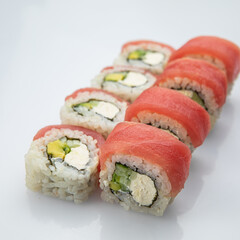 Japanese cuisine. Sushi roll on white background.