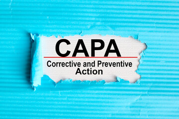 Concept image of Business Acronym CAPA Corrective and Preventive action, text on white paper on notepad on white background