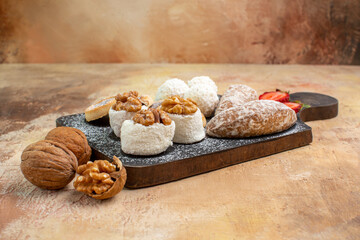 front view yummy sweets with cookies and confitures on wooden desk sweet cakes pie