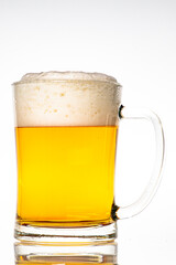 Fresh beer in a thick glass mug. A glass container for drinking alcohol.