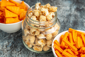 front view different snacks popcorn rusks and cips on dark background movie snack rusk cinema