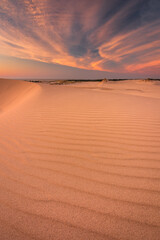 Moving dunes in the Słowiński National Park after sunset with an incredibly beautiful sky.