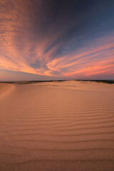 Moving dunes in the Słowiński National Park after sunset with an incredibly beautiful sky.