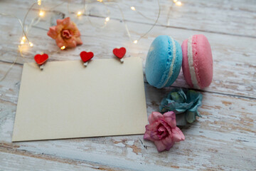 card with clothespins hearts and macaroon cakes
