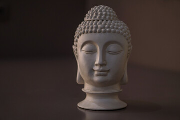 Sculpture of a bust of a Buddha. Eastern god in Buddhism. India and Sri Lanka beliefs