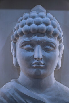 Sculpture of a bust of a Buddha. Eastern god in Buddhism. India and Sri Lanka beliefs