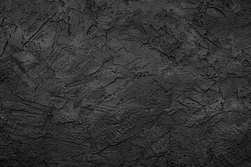 Black stone background texture. Black stone plaster cement. Grunge wall. Graphite