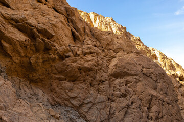 Coloured Canyon in Dahab on South Sinai (Egypt) peninsula. Desert rocks of multicolored sandstone background..