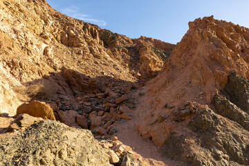 Coloured Canyon in Dahab on South Sinai (Egypt) peninsula. Desert rocks of multicolored sandstone background..