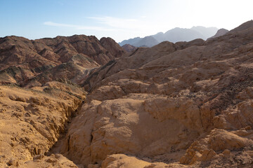 Coloured Canyon in Dahab on South Sinai (Egypt) peninsula. Desert rocks of multicolored sandstone background..