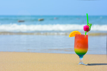 Exotic summer cocktail drinks on a beach. Summer holiday and relaxing. Beach with sand and palms. Vacation in paradise concept. Tropical resort.