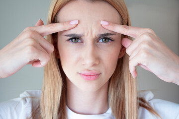 
anime girl with wrinkles on the bridge of her nose