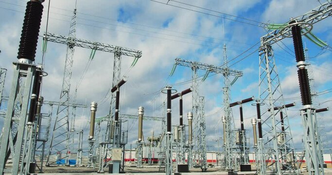 Massive metal structures at the power plant, power lines and transformers, 4k